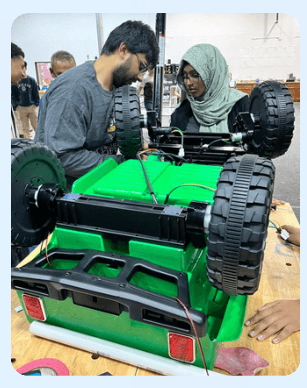 ITKAN students building a custom ride-on car for GoBabyGo