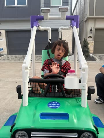 ITKAN team modifying a ride-on car for GoBabyGo
