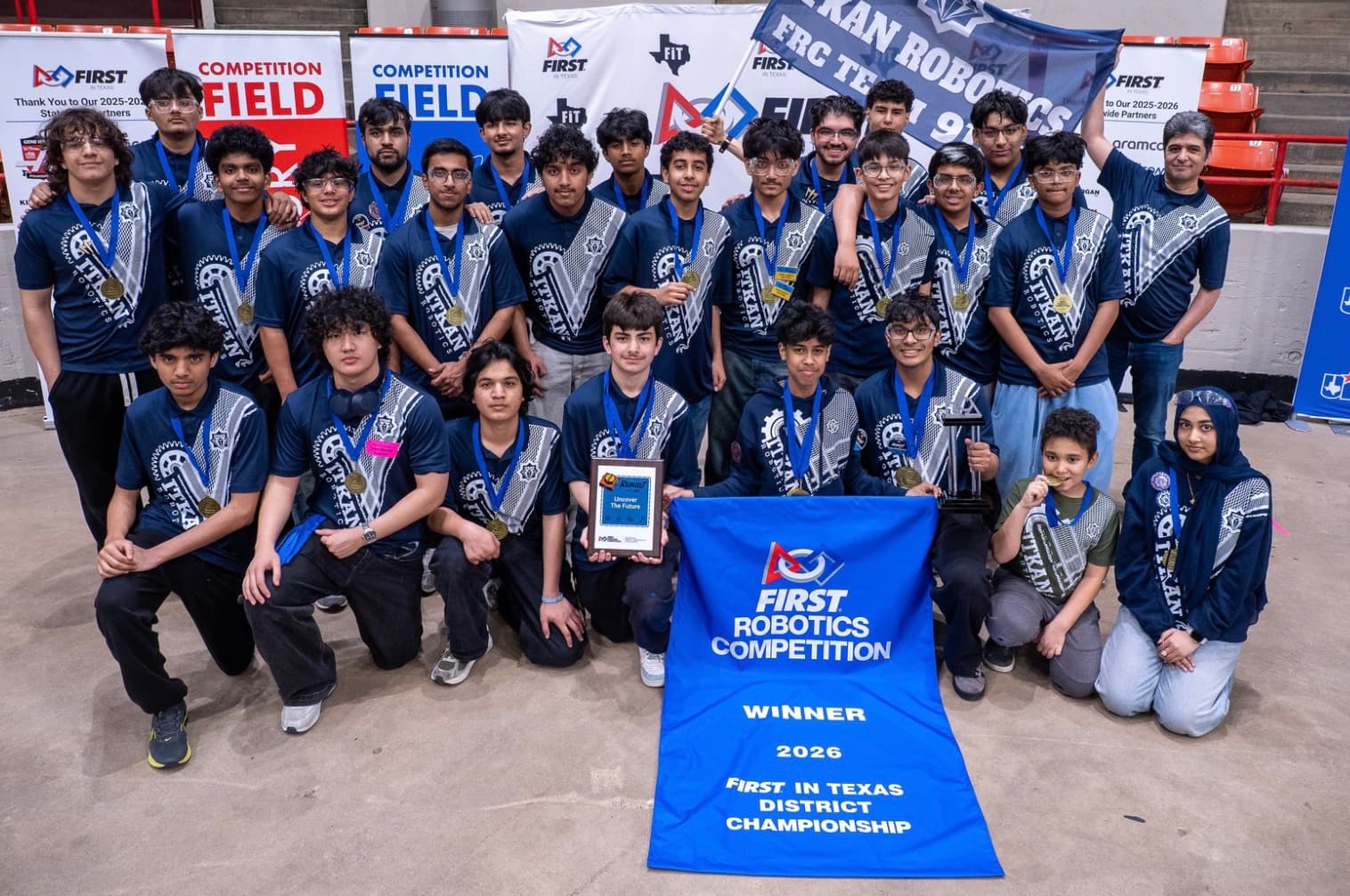 ITKAN Robotics Team 9128 with the 2026 FIRST In Texas District Championship winner banner